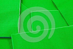 A closeup of colourful paper napkins in bright green.