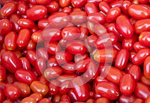 Background of lots of organic red grape tomatoes