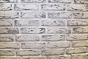 The background is made of artificial stone, white and black, with a rectangular shape in the form of a brick wall. Backgrounds, te