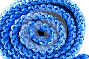 Background made of blue curled microfiber material, front view, macro shot.