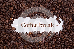 Background made of coffee beans with message `Coffee break`