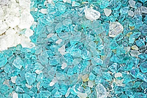 background made of glass blue and white transparent stones