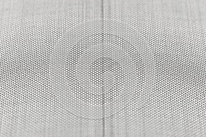 Background made from a macro photo of a fine metal mesh used for water filtration, isolated on a white background, selective focu