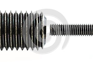A background made from a macro shot of a grease coated black screw thread, isolated on a white background, comparison of large thr