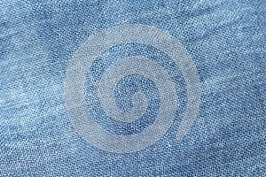 Background made of natural fabric. Texture of natural linen or cotton fabric. The color is denim or blue