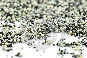A background made out of strewn inside an activated carbon filter and water filter balls, isolated on a white background, selectiv