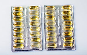 Packs of tablets and pills in white yellow blue and brown color