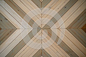 The background is made of wooden boards arranged diagonally. The boards are connected in the center, have a different color of