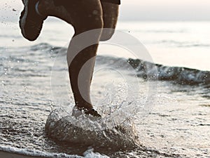 Background of a man running on the beach.