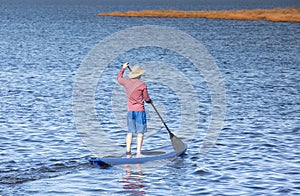 Background of Man on Standup Paddle Board