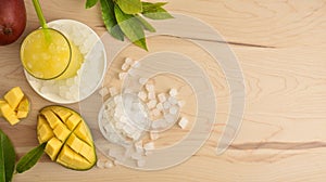 Background with mango drink with ice on table top view