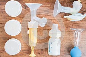 Background of manual, automatic breast pump, baby bottle with milk