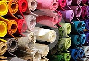 background of many rolls of colored felt