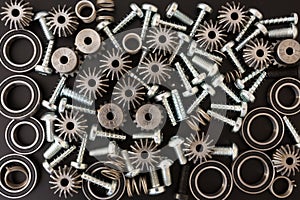 Mechanical components on black background. Industrial objects