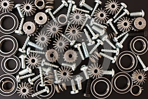 Mechanical components on black background. Industrial objects