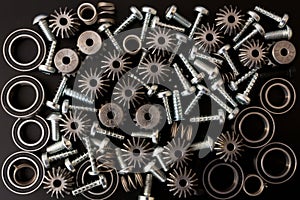 Mechanical components on black background. Industrial objects