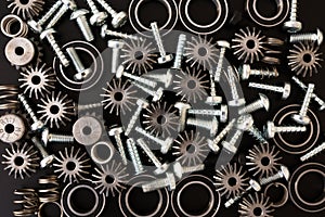 Mechanical components on black background. Industrial objects