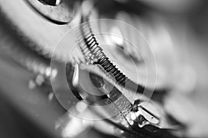 Background with metal cogwheels a clockwork. Macro