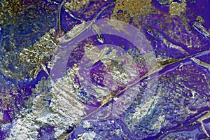 Background with metal oxidation effect. blending shades of purple and silver