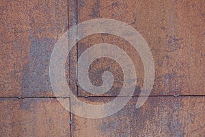 background of metal surface covered with tin sheets with brown rust