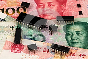 Background with microchips on China Yuan currency banknotes. Industry Crisis Concept. Trade War