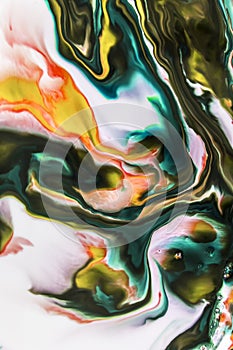 Background of milk and colored diluted paints in it