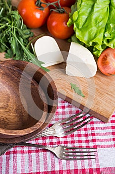 Background from mixed vegetables with wood board