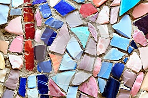 Background from a mosaic of different shapes of tiles and multicolors