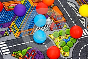 Background from multi-colored plastic balls on the floor