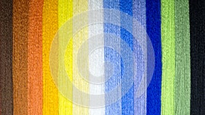 Background from multi-colored threads. A rainbow of thread.