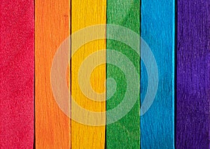 Background from multicolored boards in colors of rainbow. Background texture of colorful wooden planks