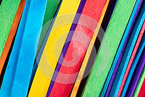 Background from multicolored boards in colors of rainbow. Piles of colorful wooden planks