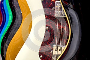 Background of multicolored guitars. Electric guitars close-up