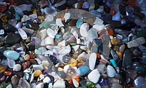 Background from multicolored polished stones background