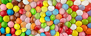 Background of multicolored sweet candy assorted on table surface