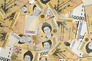 Background with multiple Korean 50,000 won banknotes