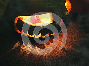 Background for the mystical holiday Halloween. Religious beliefs. Jack-o`-lantern pumpkin decorative lantern