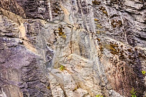 Background of natural gray stone wall texture rough rock surface