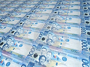A background of neat rows of 1000 Philippine peso bills. Philippine currency. Paper money or banknotes of the Philippines