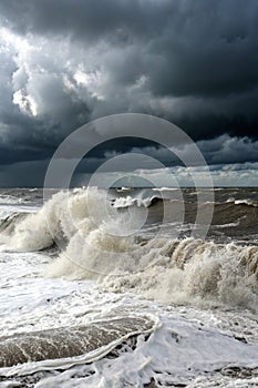 Background ocean storm with waves and clouds photo