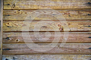 Background of old boards yellow and purple with knots hammered nails