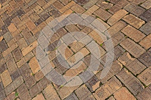 Background of old brick pavers, surface pattern, herringbone layout