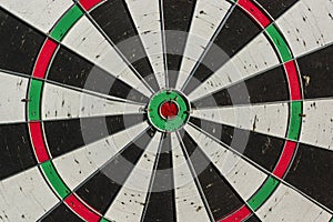 Background of old dart board with many holes