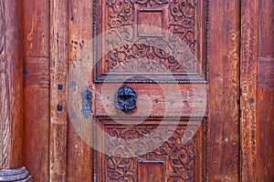 background of old grunge, medieval wooden texture. part of antique old door with iron antique knob