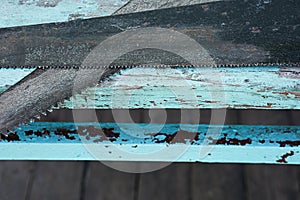 Background with old saws on blue wooden boards