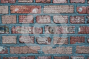 Background from old surface, Wall with red old bricks, outdoor destructive weathering, textured rough surface. Close-up