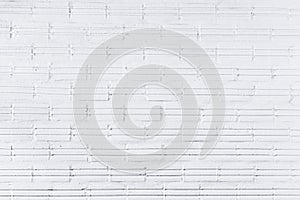 Background of old vintage white brick wall with peeling plaster, texture