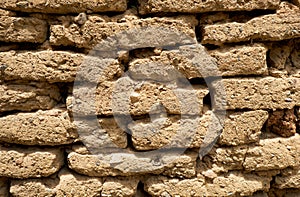 Background of old wall made of adobe or mudbrick masonry