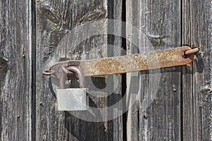 Background from an old wooden door with a rusty lock