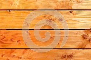 Background of orange oiled wooden planks